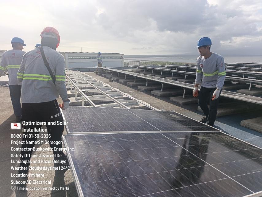 AD Electrical technicians installing rooftop solar panels at SM Sorsogon